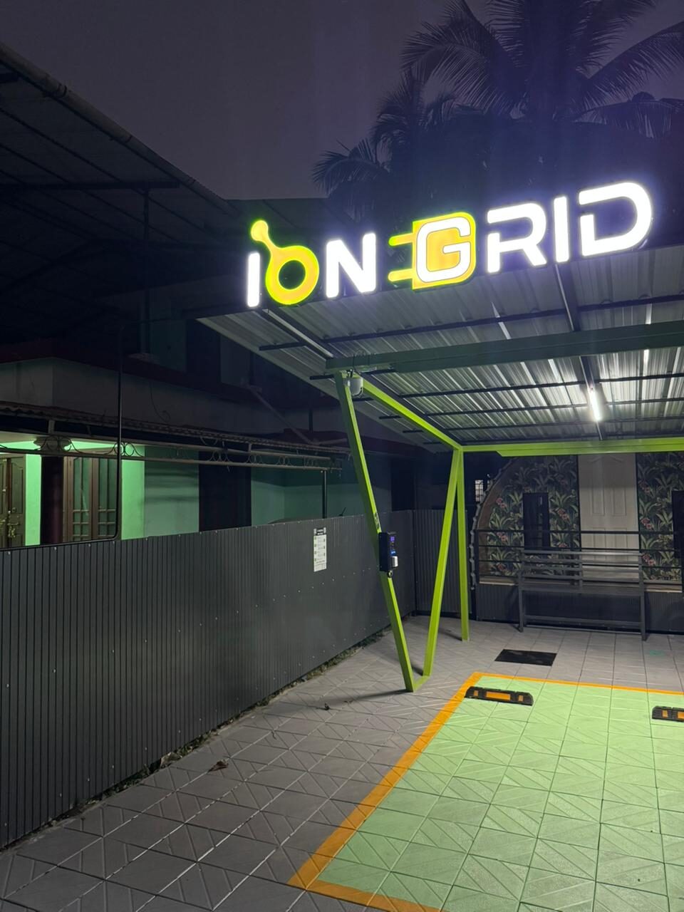 Station at night with lit IONGRID signage